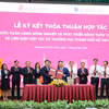 Lễ ký kết thỏa thuận hợp tác giữa Agribank và Saigon Co.op. (Ảnh: Vietnam+)