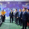 Ông Đặng Công Hoàn - Phó Tổng Giám đốc LPBank giới thiệu về ứng dụng LPBank Plus trước các đại biểu tham dự chương trình. (Ảnh: Vietnam+)