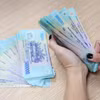 Hơn 1,22 triệu tỷ đồng đang nằm trong tài khoản thanh toán cá nhân. (Ảnh: Vietnam+)