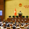 Quốc hội biểu quyết thông qua Luật Hộ tịch (sửa đổi). Ảnh: Doãn Tấn - TTXVN