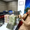 Ngân hàng Nhà nước đang lên lộ trình bỏ room tín dụng. (Ảnh: Vietnam+)