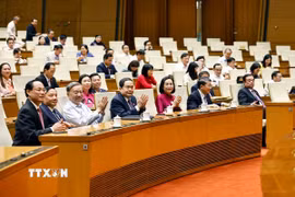 Tổng Bí thư Tô Lâm, Chủ tịch Quốc hội Trần Thanh Mẫn và đại biểu Quốc hội dự lễ công bố. (Ảnh: Doãn Tấn/TTXVN)