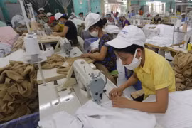 Sản xuất hàng xuất khẩu sang thị trường Nhật Bản tại Công ty Cổ phần dệt may Sơn Nam, tỉnh Nam Định. (Ảnh: Trần Việt/TTXVN)