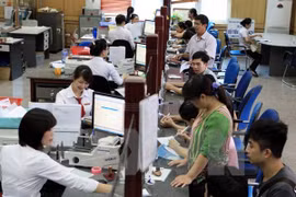 Giao dịch tại Agribank. (Ảnh: Trần Việt/TTXVN)