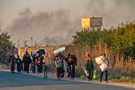 Người dân Syria rời đi lánh nạn. (Nguồn: The Globe and Mail)