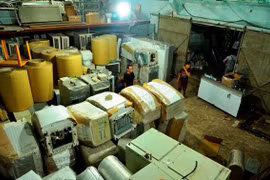 Một kho hàng điện máy được công an kiểm tra trước đó. (Nguồn: sggp.org.vn)