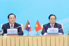 Thủ tướng Phạm Minh Chính và Thủ tướng Lào Sonexay Siphandone dự Hội nghị hợp tác đầu tư Việt Nam-Lào 2024. (Ảnh: Dương Giang/TTXVN)