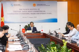 Bộ trưởng Bộ Công Thương Trần Tuấn Anh chủ trì cuộc họp tại đầu cầu Hà Nội. (Ảnh: Trần Việt/TTXVN)