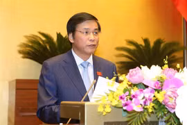 Ủy viên Ủy ban Thường vụ Quốc hội, Tổng Thư ký Quốc hội - Chủ nhiệm Văn phòng Quốc hội Nguyễn Hạnh Phúc trình bày Báo cáo giải trình, tiếp thu, chỉnh lý dự thảo Nghị quyết kỳ họp thứ 7, Quốc hội khóa XIV. (Ảnh: Doãn Tấn/TTXVN)
