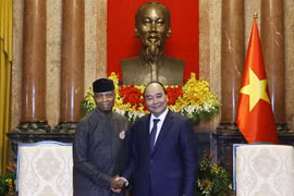 Chủ tịch nước Nguyễn Xuân Phúc tiếp Phó Tổng thống CHLB Nigeria Yemi Osinbajo. (Ảnh: Thống Nhất/TTXVN)