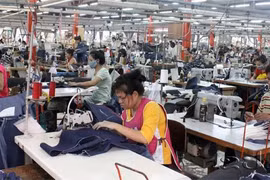 Công nhân dệt may tại Lào. (Nguồn: KPL)
