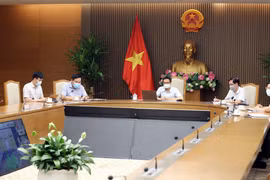  Phó Thủ tướng Vũ Đức Đam, Trưởng Ban Chỉ đạo Quốc gia phòng, chống dịch COVID-19 chủ trì họp trực tuyến với lãnh đạo các tỉnh Bắc Ninh và Bắc Giang về công tác phòng, chống dịch ở các địa phương này. (Ảnh: Phạm Kiên/TTXVN)