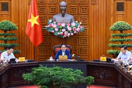 Thủ tướng Phạm Minh Chính chủ trì họp Thường trực Chính phủ về kiểm soát lạm phát. (Ảnh: Dương Giang/TTXVN)