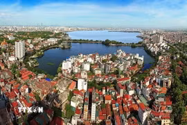 Đối với trụ cột đất đai và tài nguyên, thành phố Hà Nội sẽ chuyển từ "quản theo chỉ tiêu diện tích" sang "quản theo hiệu quả sử dụng đất": áp KPI cho từng khu vực. (Nguồn: TTXVN)