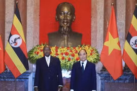 Chủ tịch nước Nguyễn Xuân Phúc và Tổng thống Uganda Yoweri Kaguta Museve. (Ảnh: Thống Nhất/TTXVN)