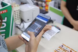 Thanh toán bằng QRCode đang trở nên phổ biến trong nhiều giao dịch. (Ảnh minh họa: TTXVN)