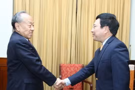 Phó Thủ tướng, Bộ trưởng Ngoại giao Phạm Bình Minh tiếp ông Lý Triệu Tinh. (Ảnh: Lâm Khánh/TTXVN)