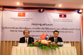 Hai Bộ trưởng, Chủ nhiệm Văn phòng Chính phủ hai nước đang chủ trì ​hội thảo. (Ảnh: Phạm Kiên/Vietnam+)