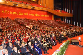 Đại biểu dự phiên khai mạc Đại hội XIII của Đảng. (Ảnh: TTXVN)