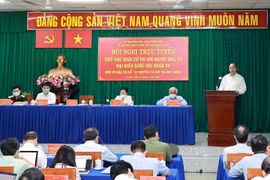Chủ tịch nước Nguyễn Xuân Phúc trình bày chương trình hành động động tại điểm cầu xã Phước Thạnh, huyện Củ Chi. (Ảnh: Thống Nhất/TTXVN)