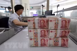 Đồng nhân dân tệ tại một ngân hàng ở Giang Tô, Trung Quốc. (Ảnh: AFP/TTXVN)
