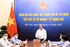 Chủ tịch nước Nguyễn Xuân Phúc phát biểu tại điểm cầu Hà Nội. (Ảnh: Thống Nhất/TTXVN) 