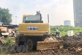 Hiện trường một buổi thu hồi đất ở Hà Nội. (Nguồn: TTXVN)