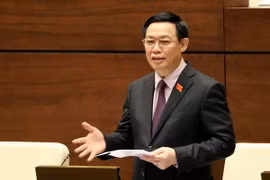 Phó Thủ tướng Vương Đình Huệ trả lời chất vấn của Đại biểu Quốc hội. (Ảnh: Phương Hoa/TTXVN)