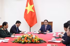 Hình ảnh Thủ tướng Phạm Minh Chính điện đàm với Thủ tướng Trung Quốc
