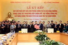Văn phòng Chính phủ và Bộ Công Thương ký quy chế phối hợp trong công tác tham mưu giúp Chính phủ xây dựng Chính phủ điện tử và cải cách thủ tục hành chính. (Ảnh: Đức Duy/Vietnam+)
