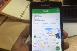 Ứng dụng phần mềm gọi xe của Grab. (Ảnh: Việt Hùng/Vietnam+)