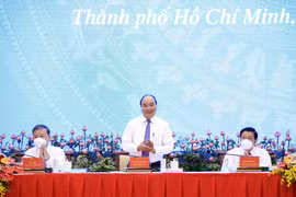 Chủ tịch nước Nguyễn Xuân Phúc chủ trì Hội thảo quốc gia lần thứ 3 về xây dựng và hoàn thiện Nhà nước pháp quyền xã hội chủ nghĩa. (Ảnh: Thống Nhất/TTXVN) 