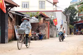 Cuộc sống của người dân xã Sơn Lôi. (Ảnh: Hoàng Hùng/TTXVN)