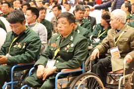 Các đồng chí thương binh, bệnh binh tại buổi gặp mặt. (Ảnh: PV/Vietnam+) 