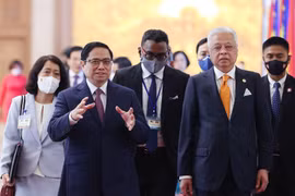 Thủ tướng Phạm Minh Chính và Thủ tướng Malaysia Dato’ Sri Ismail Sabri bin Yaakob. (Ảnh: Dương Giang/TTXVN) 
