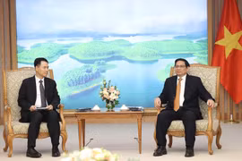 Thủ tướng Phạm Minh Chính tiếp Bộ trưởng Bộ Công Thương Lào Malaythong Kommasith. (Ảnh: Dương Giang/TTXVN)