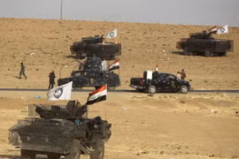 Các lực lượng an ninh Iraq trong một chiến dịch truy quét phiến quân IS. (Nguồn: AFP/TTXVN)