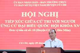 Chủ tịch nước Nguyễn Xuân Phúc trình bày chương trình hành động tại buổi tiếp xúc cử tri huyện Củ Chi. (Ảnh: Thống Nhất/TTXVN)