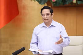 Thủ tướng Phạm Minh Chính nhấn mạnh phương châm lấy xã, phường, thị trấn, nhà máy, xí nghiệp làm “pháo đài,” mỗi người dân là “chiến sỹ” phòng chống dịch COVID-19. (Ảnh: Dương Giang/TTXVN)
