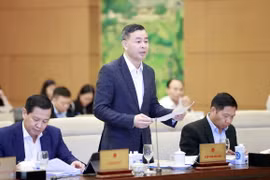 Tổng Kiểm toán Nhà nước Ngô Văn Tuấn trình bày Tờ trình dự thảo Pháp lệnh Xử phạt vi phạm hành chính trong lĩnh vực kiểm toán nhà nước. (Ảnh: Doãn Tấn/TTXVN)