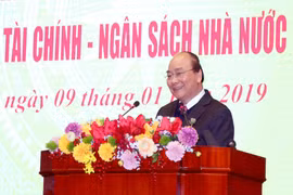Thủ tướng Chính phủ tại hội nghị tổng kết ngành tài chính chiều 9/1. (Ảnh: CTV/Vietnam+)