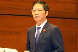 Bộ trưởng Bộ Công thương Trần Tuấn Anh trả lời chất vấn trước Quốc hội, sáng 15/11. (Ảnh: Thống Nhất/TTXVN)