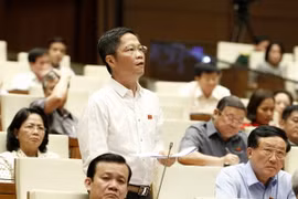 Bộ trưởng Bộ Công Thương Trần Tuấn Anh phát biểu, giải trình các vấn đề đại biểu nêu. (Ảnh: Văn Điệp/TTXVN)