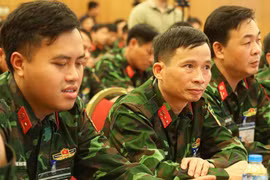 Các kiểm định viên quân sự chi viện cho Hà Nội và Thành phố Hồ Chí Minh. (Ảnh: CTV/Vietnam+)