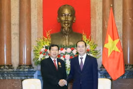 Chủ tịch nước Trần Đại Quang tiếp Chánh án Tòa án nhân dân tối cao Lào Kham Phanh Sit Thi Dam Pha đang có chuyến thăm và làm việc tại Việt Nam. (Ảnh: Nhan Sáng/TTXVN.)