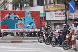 Tuyên truyền phòng chống COVID-19. (Nguồn: TTXVN)