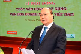Thủ tướng Nguyễn Xuân Phúc đến dự và phát biểu tại Lễ phát động cuộc vận động xây dựng văn hóa doanh nghiệp. (Ảnh: Thống Nhất/TTXVN)