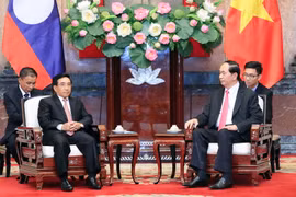 Chủ tịch nước Trần Đại Quang tiếp ông Phankham Viphavan, Ủy viên Bộ Chính trị, Thường trực Ban Bí thư, Phó Chủ tịch nước Lào. (Ảnh: Nhan Sáng/TTXVN)