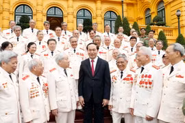 Chủ tịch nước Trần Đại Quang gặp mặt thân mật Đoàn đại biểu Ban liên lạc Cán bộ công an chi viện chiến trường miền Nam thời kỳ kháng chiến chống Mỹ, cứu nước. (Ảnh: Nhan Sáng/TTXVN)