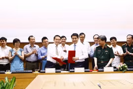 Quang cảnh lễ ký kết. (Ảnh: An Đăng/TTXVN)